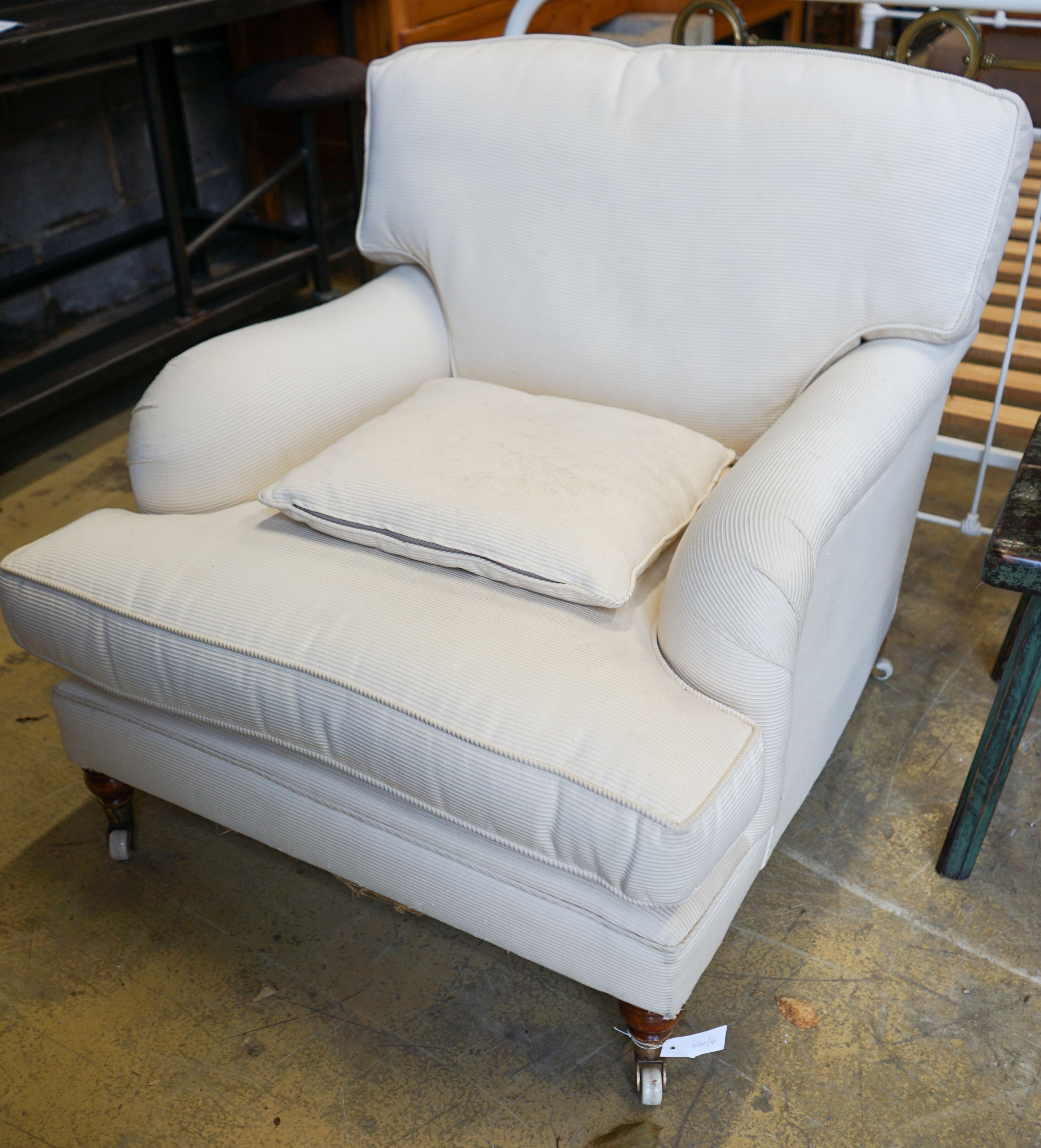 A Howard style upholstered armchair, width 84cm, depth 100cm, height 82cm